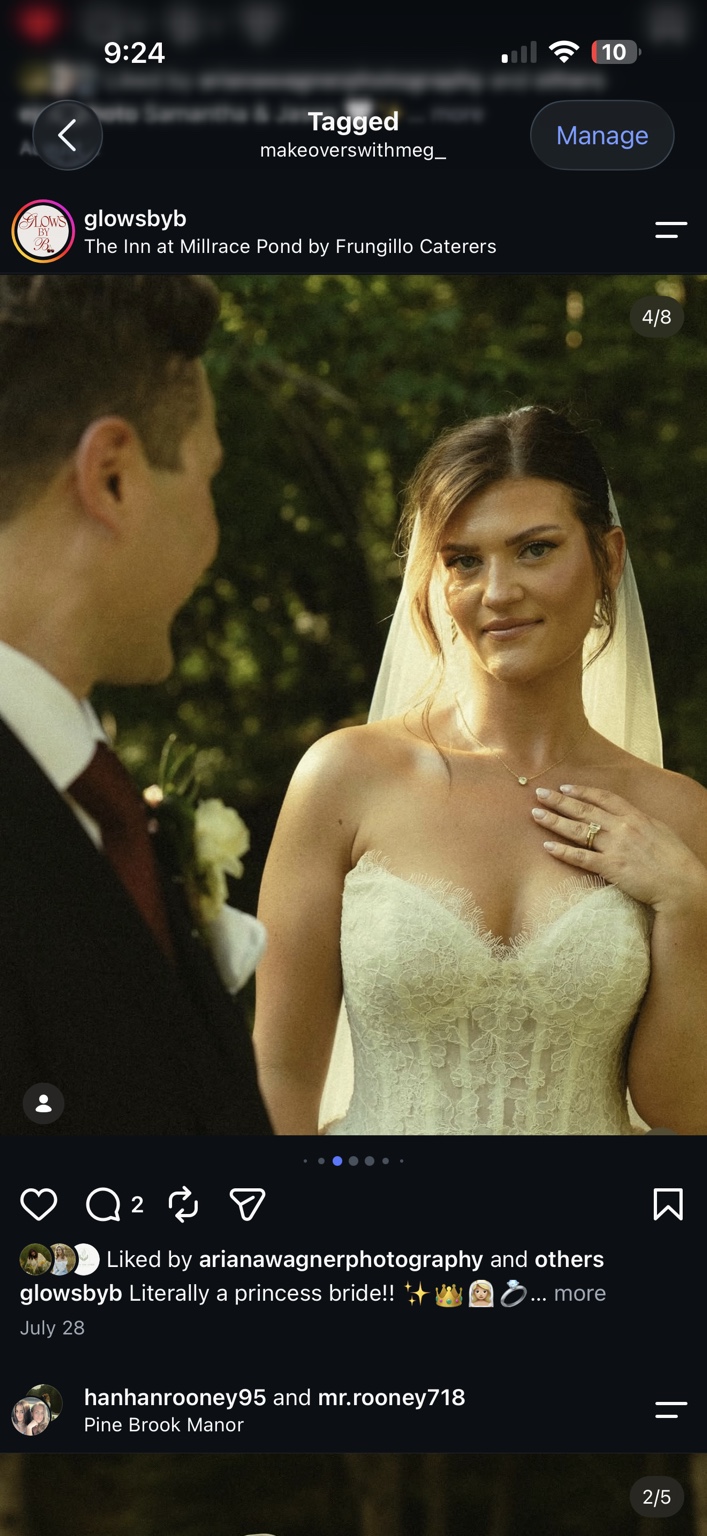 Bride in a lace gown and veil smiling at her partner in warm evening light